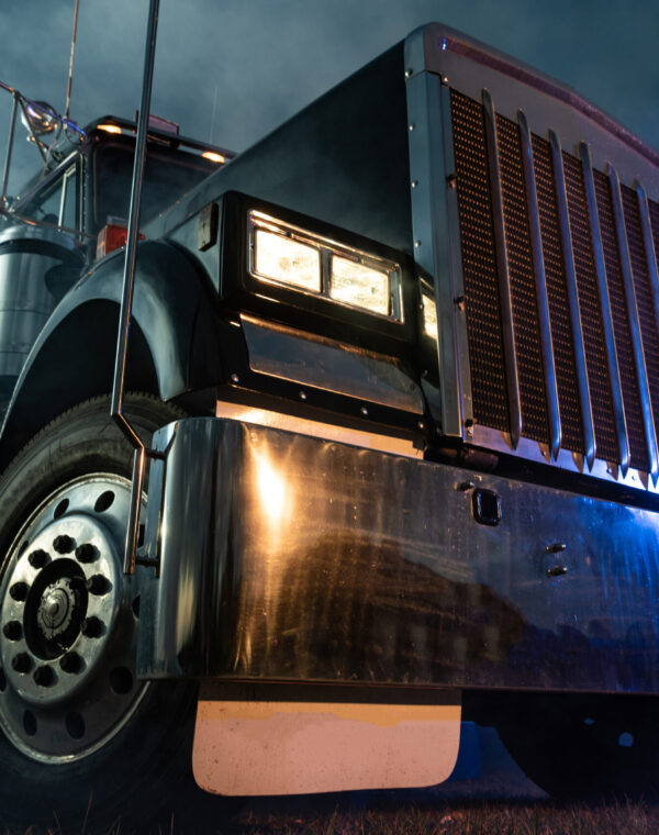 Retro Semi Truck Tractor Night Time Illumination Retro Semi Truck Tractor Night Time Bluish Illumination and Foggy Atmosphere. Trucking Concept. Transportation Industry Theme.